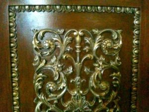 Cabinet door with embellishments